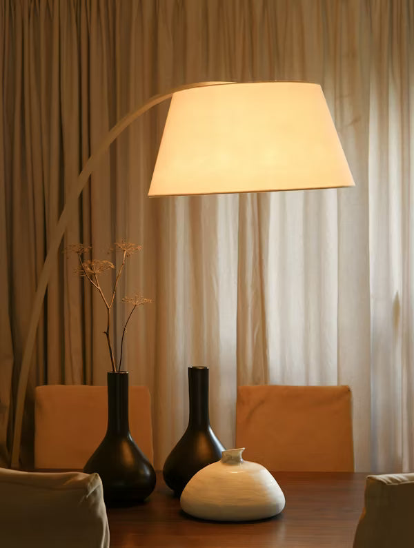 Modern table lamp adding warm lighting to a stylish bedroom décor